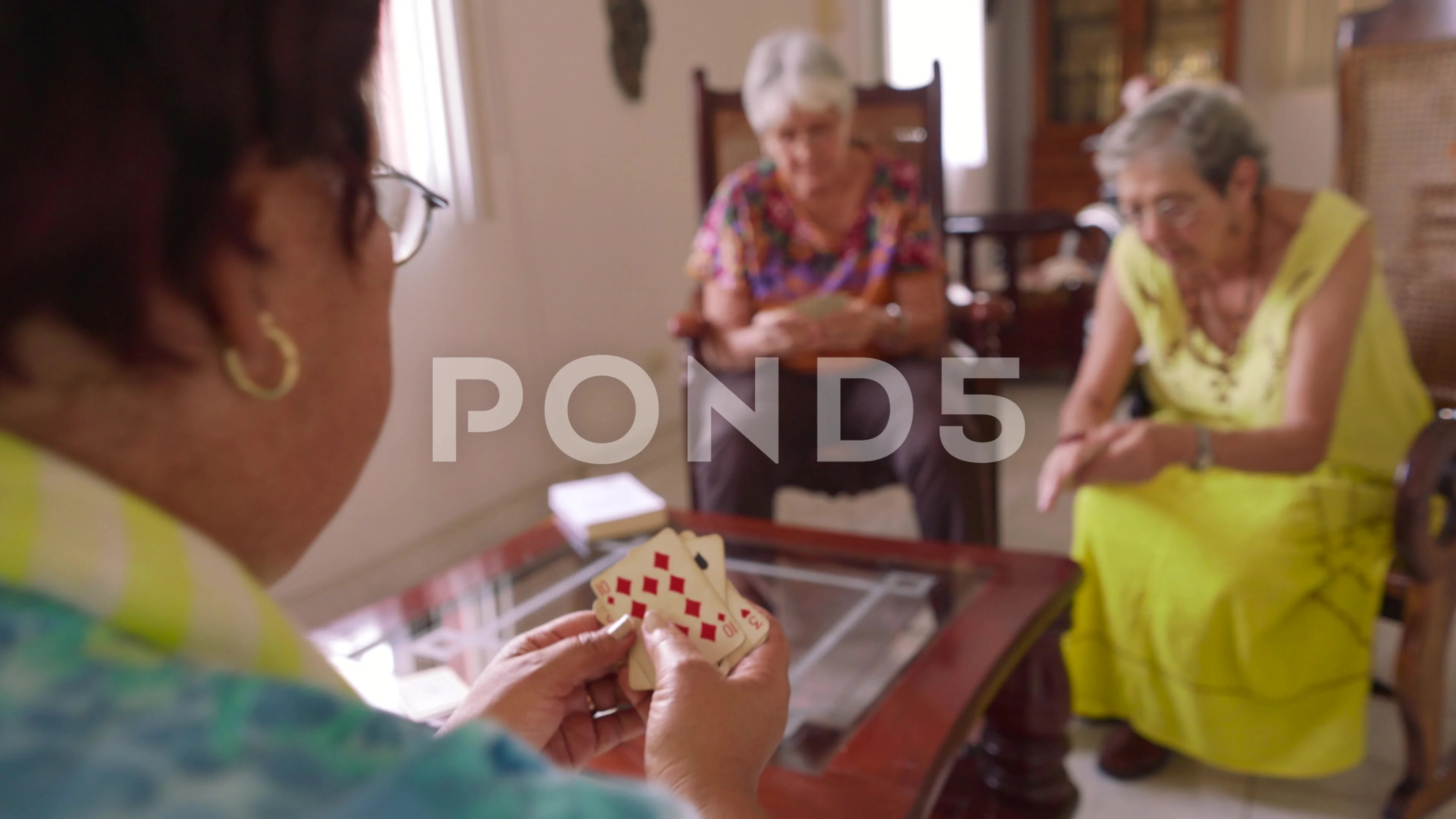 Old Women Have Fun Playing Card Game In Hospice