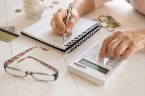 Old women's hands count expenses, plan a budget the concept of retirement, sa Stock Photos