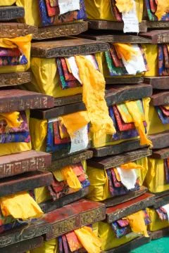 Old wood boxes containing precious Tibetan old and sacred text. Stock Photos