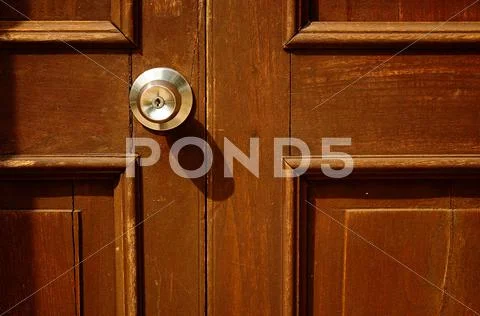 Old wood door with handle on it Stock Photos