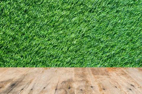 Old wood on grass background Illustrazione stock