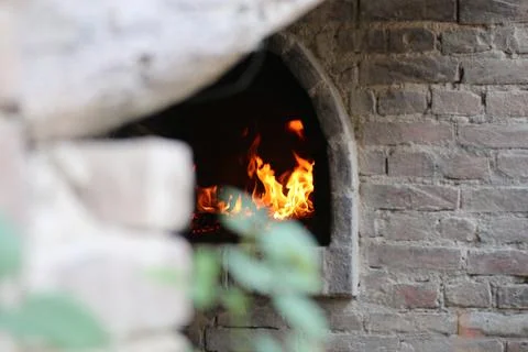Old wood oven with fire Stock Photos