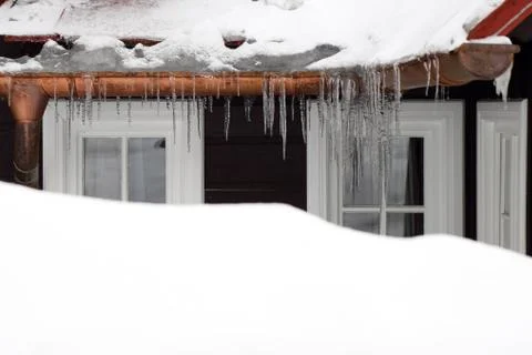 Old wood windows with icicles Stock Photos