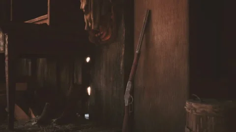 Old wooden barn interior featuring a vintage rifle leaning against the wall Stock Footage 331399585