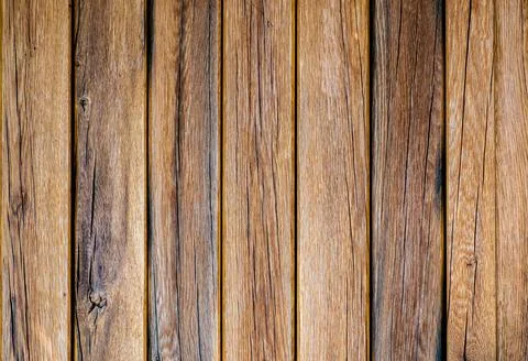 Old wooden barn wall background. The texture of the boards. Stock Photos