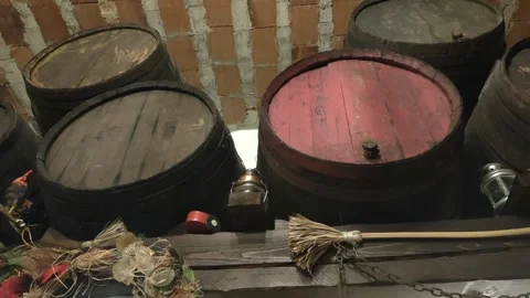 Old wooden barrels aging in rustic wine cellar Stock Footage 341512825