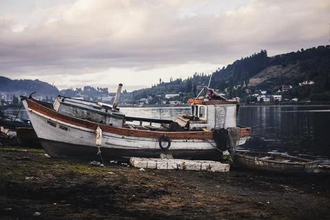 Old Wooden Boat at Low Tide in Castro Chiloe, Chile Stock Photos