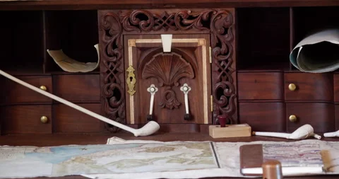 Old wooden colonial table with maps sitting on table Video stock 171195598