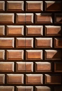 Old wooden door with embossed rectangular shapes - Trentino Italy Stock Photos