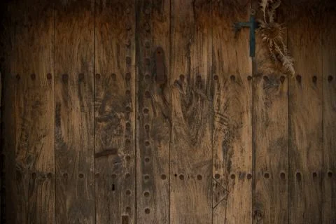 Old wooden door with metal knobs background Fotos de archivo