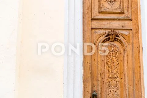 Old wooden door with paint and decrepit colored facade in Havana Stock Photos