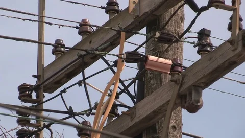 Old wooden electrical power utility poles wires and lines Stock Footage 74178715