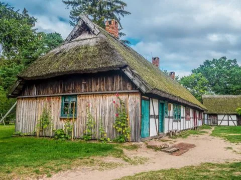 Old wooden farmstead in Kluki, Poland Old wooden farmstead with typical ti... Stock Photos