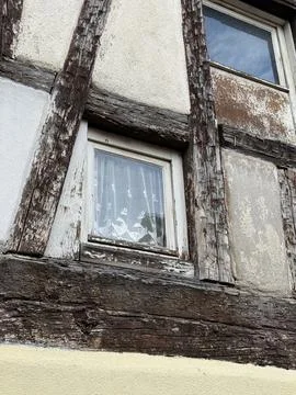 Old Wooden Framed Window with Rustic Textures. Colmar, France 10.01.2025 Stock Photos