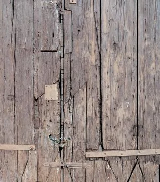 Old wooden gate locked with padlock and chain Stock Photos