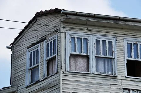 Old wooden house. Open windows of a wooden house. Stock Photos