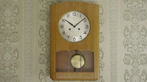 Old wooden pendulum clock, vintage wallpaper, HQ audio Stock Footage