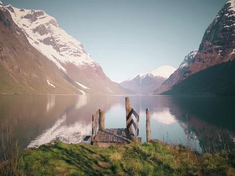 Old wooden pier at the lake in Norway Stock Footage
