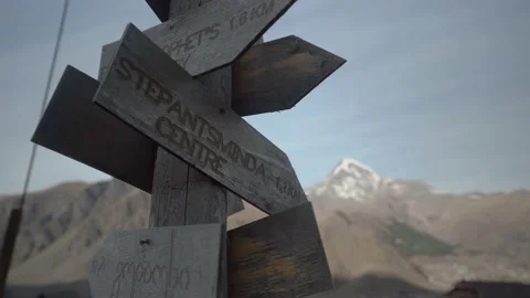 Old wooden pointer in Stepantsminda, Georgia Mounstains Video stock 231250331
