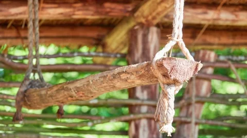 Old wooden shelf hangs on ropes under canopy. It is intended for drying dried Stock Footage 201855760