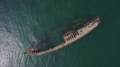 An old wooden ship stranded on the coast, footage taken from the air on a qu Stock Footage 246478285