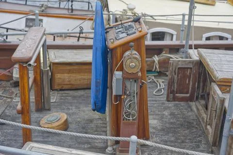 Old wooden ship with weathered bridge and vintage navigation equipment Stock Photos