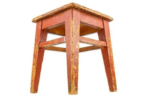 Old wooden stool with brown peeling paint. Loft style chair isolated on a white Stock Photos