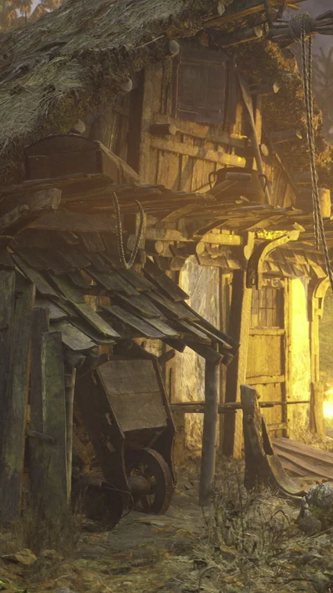 Old wooden structure with a cart in a rustic setting during the evening light Stock Footage 335943546