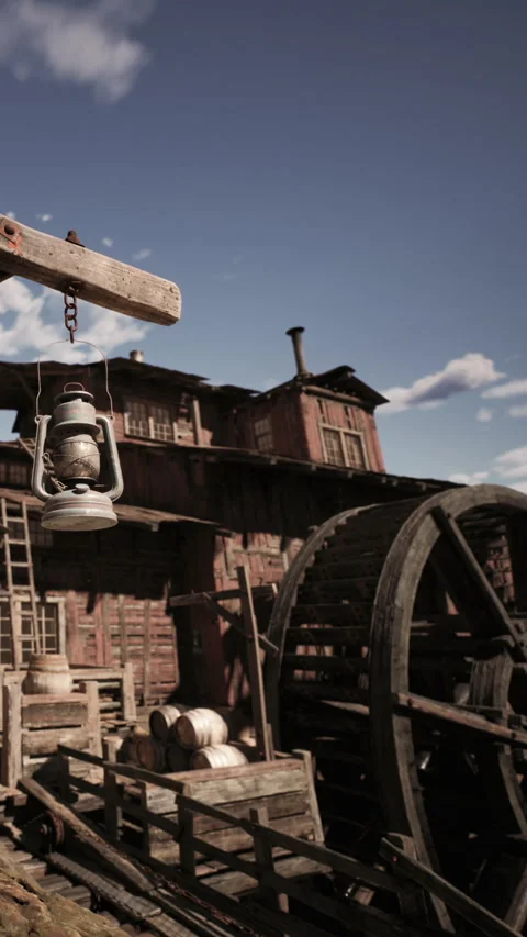 Old wooden structure with lantern and water wheel in historic setting Stock Footage 339033588