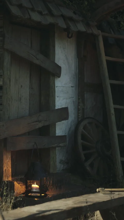Old wooden structure with lantern and wagon wheel by the door Stock Footage 342158554