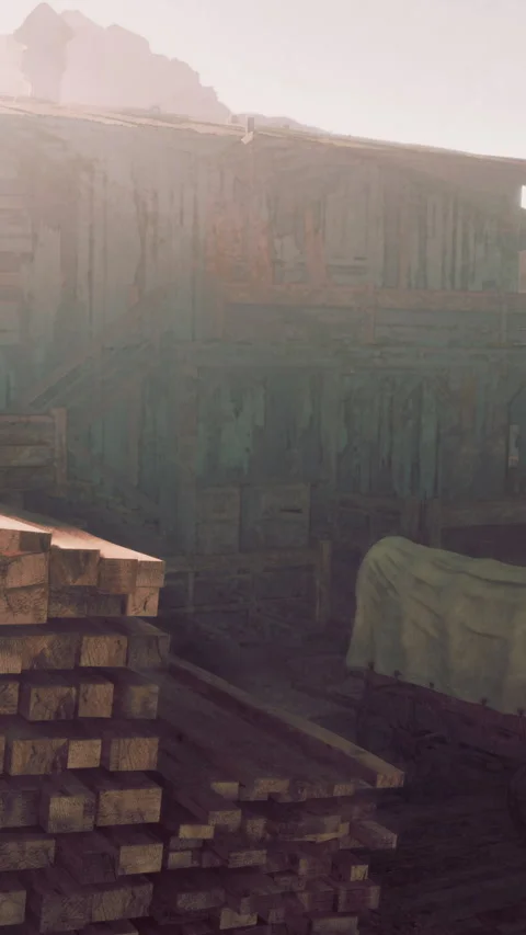 Old wooden structure near a stack of logs and a covered cart at sunset Stock Footage 337972023