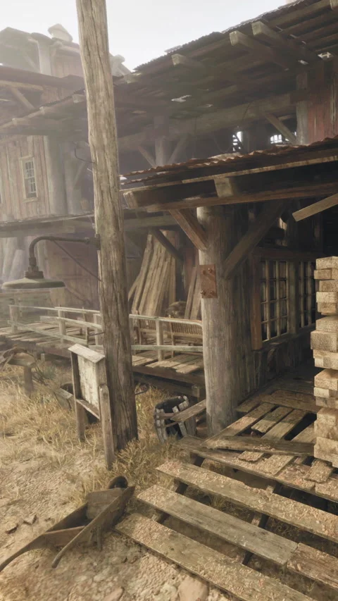 Old wooden structures stand in an abandoned area with overgrown grass Video stock 340258507