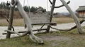 Old wooden swing hanging on ropes at open-air history and folklife museum HD Footage