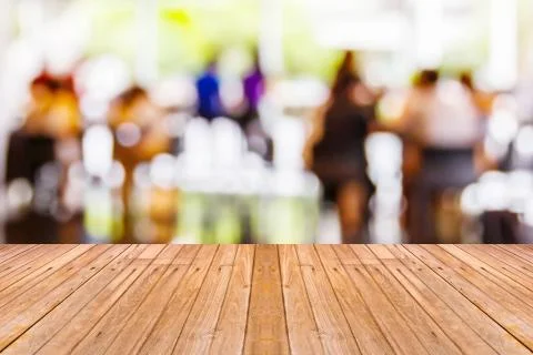 Old wooden table with blur coffee shop background Stock Photos