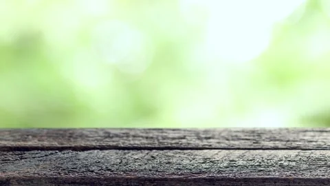 Old wooden table with soft sunlight and natural bokeh background Stock Footage 328235007