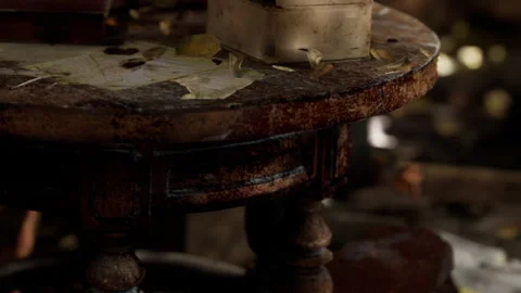 Old wooden table surrounded by nature with scattered leaves and items Stock Footage 345005011