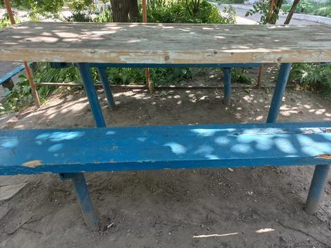 Old wooden table in the yard. table in the gazebo. Soviet furniture. Ukrainia Stock Photos