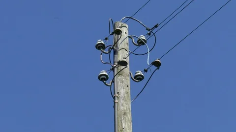 Old wooden telegraph pole, blue sky, Germany Stock Footage 129147553
