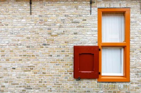 Old wooden window on brick wall Stock Photos