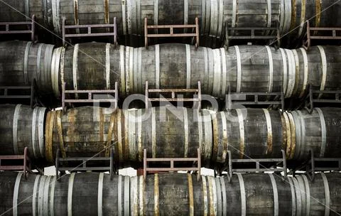 Old wooden wine barrels, detail of containers for wine preservation, wine cel Stock Photos