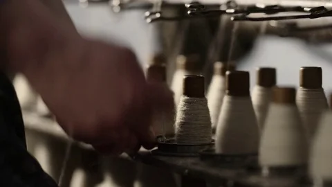 Old wool spindle and virgin wool weaving machinery Stock Footage 74510279