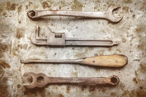 Old work tools on a metal background Stock Photos