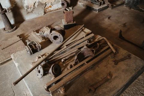 Old workbench at an antique workshop with metallic tools Stock Photos