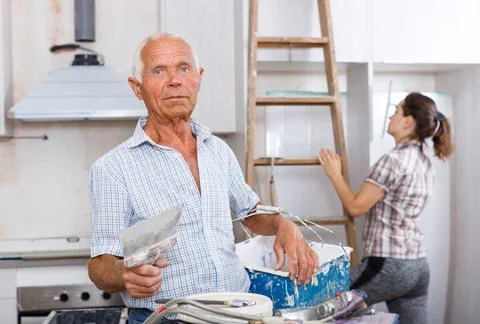 Old worker with plastering tools Stock-Fotos