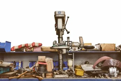 Old workshop bench with press drill and tools isolated on a white background Stock Photos