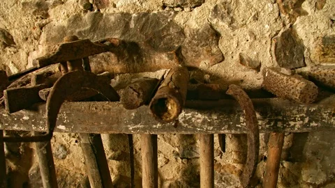 In an old Workshop, is an Old shelf with blacksmith tools. Видео 89882344
