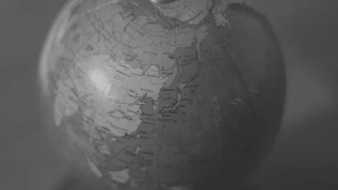 Old World Globe Rotating in Black and White Focused on Europe Stock Footage 258557403