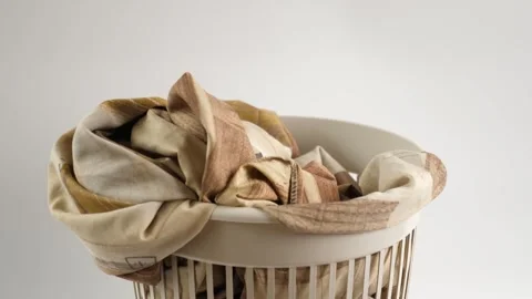 Old, worn clothes are thrown into the trash can. Disposal and recycling of cl Stock Footage 266441962