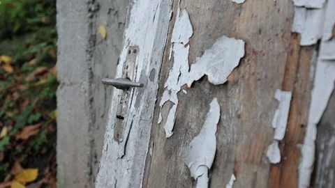 Old worn doors, paint peeling from the sun and rain. Stock Footage 218315487