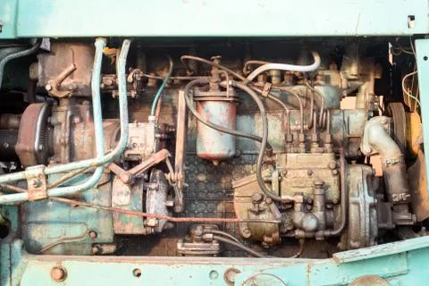 Old worn engine block of a large industrial machine in color showing the mach Stock Photos